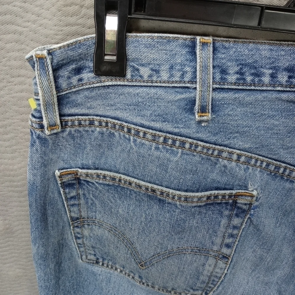 Levis 501XX men's button fly blue jeans. Sz 38x34.tear in seat. See last pic. M2